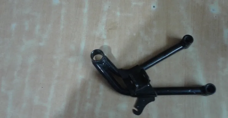 Two-wheeler footrest and bracket assemblies in matched right-hand and left-hand pairs, black finish